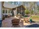 Inviting outdoor patio area with comfortable seating, a grill, and manicured landscaping at 356 Savannah Dr., Pawleys Island, SC 29585