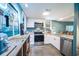 Bright kitchen featuring stainless steel appliances and plenty of counter space at 358 Salt Marsh Circle # 10-A, Pawleys Island, SC 29585