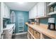 Laundry room with washer and dryer, ample storage, and butcher block countertops at 358 Salt Marsh Circle # 10-A, Pawleys Island, SC 29585