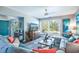 Bright and airy living area with a comfortable sofa and large window at 358 Salt Marsh Circle # 10-A, Pawleys Island, SC 29585