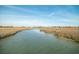 Picturesque view of a tranquil waterway surrounded by marsh grasses under a clear sky at 358 Salt Marsh Circle # 10-A, Pawleys Island, SC 29585