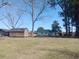 Expansive backyard with storage sheds, providing ample space for outdoor activities and storage at 360 South Green Sea Rd., Loris, SC 29569