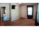 Bedroom featuring light gray walls, carpet, a window, a tv, and a door leading to another room at 360 South Green Sea Rd., Loris, SC 29569