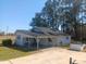 Rear view of a charming one-story home with a convenient carport and spacious driveway at 360 South Green Sea Rd., Loris, SC 29569