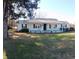 Charming one-story home with a metal roof and inviting front porch perfect for rocking chairs at 360 South Green Sea Rd., Loris, SC 29569