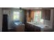 Charming kitchen features wood cabinets, white countertops, and an island with cooktop at 360 South Green Sea Rd., Loris, SC 29569