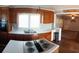 Open kitchen featuring white countertops, wood cabinetry, and views into the adjacent living room at 360 South Green Sea Rd., Loris, SC 29569