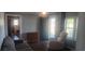 Cozy living room with warm wood floors, comfortable seating, and a view to the front porch at 360 South Green Sea Rd., Loris, SC 29569