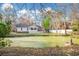 This property features a serene backyard pond, surrounded by lush greenery and mature trees at 3740 Limerick Rd., Myrtle Beach, SC 29579