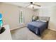 Bright bedroom with a ceiling fan, window with natural light, comfortable bed, and carpet flooring at 3740 Limerick Rd., Myrtle Beach, SC 29579