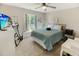 Comfortable bedroom with a ceiling fan, carpet, and window offering natural light and complemented by neutral-colored walls at 3740 Limerick Rd., Myrtle Beach, SC 29579