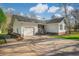 Charming single-story home with attached garage, well-maintained lawn, and inviting front porch with stairs at 3740 Limerick Rd., Myrtle Beach, SC 29579