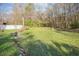 Backyard pond, well-maintained garden, wooden deck, and surrounding greenery at 3740 Limerick Rd., Myrtle Beach, SC 29579