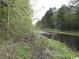 Lush river view property with mature trees and waterway perfect for nature-loving homeowners at 3740 Limerick Rd., Myrtle Beach, SC 29579