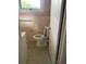 The bathroom features a toilet, tiled floor, and vintage-style fixtures for a classic feel at 3752 Tea Rose St. # 3752, Myrtle Beach, SC 29577