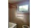 Bathroom features a window, tiled walls, and essential fixtures like a toilet and sink at 3752 Tea Rose St. # 3752, Myrtle Beach, SC 29577