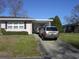 The exterior features a carport and driveway with space for parking, as well as neat landscaping at 3752 Tea Rose St. # 3752, Myrtle Beach, SC 29577