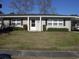 Charming single-story home with tidy landscaping, black shutters, and a brick and vinyl facade at 3752 Tea Rose St. # 3752, Myrtle Beach, SC 29577