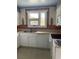 The well-lit kitchen includes a double sink, updated faucet, and white cabinets for a clean, classic look at 3752 Tea Rose St. # 3752, Myrtle Beach, SC 29577