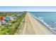 Aerial view of the home, coastline, and neighborhood. Includes a pool and beach access at 3806 North Ocean Blvd., Myrtle Beach, SC 29577