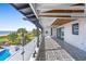 A long beachside balcony boasting a geometric tile floor, glass railing, and scenic ocean views at 3806 North Ocean Blvd., Myrtle Beach, SC 29577