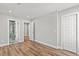 Spacious bedroom with wood flooring, a modern bathroom, and a walk-in closet at 3806 North Ocean Blvd., Myrtle Beach, SC 29577