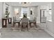 A modern dining room featuring neutral tones, stylish decor, and modern stainless steel refrigerator at 3806 North Ocean Blvd., Myrtle Beach, SC 29577