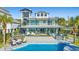 Modern home with an outdoor pool, deck with lounge seating, and covered outdoor bar area at 3806 North Ocean Blvd., Myrtle Beach, SC 29577