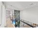 Spacious hallway featuring modern decor, sleek railing, and views of the staircase and living spaces at 3806 North Ocean Blvd., Myrtle Beach, SC 29577