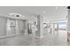 Open floor plan with a modern kitchen, gray tile floors, and stainless steel appliances at 3806 North Ocean Blvd., Myrtle Beach, SC 29577