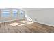 Spacious living room with hardwood floors and large windows with views of the ocean in the distance at 3806 North Ocean Blvd., Myrtle Beach, SC 29577