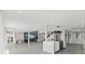 Open-concept living space with a modern kitchen, fireplace, and game area at 3806 North Ocean Blvd., Myrtle Beach, SC 29577