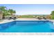Backyard pool and lounge area including ocean view, comfortable seating, and palm trees at 3806 North Ocean Blvd., Myrtle Beach, SC 29577