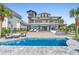 Backyard pool area with outdoor seating, tropical landscaping, and clear blue water at 3806 North Ocean Blvd., Myrtle Beach, SC 29577
