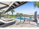 Pool area with a view of the ocean. The deck has cushioned lounge furniture and an outdoor grill at 3806 North Ocean Blvd., Myrtle Beach, SC 29577