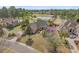 Aerial view of a beautiful brick home that backs up to a golf course and small lake at 4222 Congressional Dr., Myrtle Beach, SC 29579