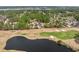 Drone view showcasing property's prime location on a golf course with a serene lake nearby at 4222 Congressional Dr., Myrtle Beach, SC 29579