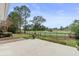 Scenic backyard features a lush green lawn and beautiful views of the golf course and lake at 4222 Congressional Dr., Myrtle Beach, SC 29579