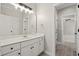 Bathroom vanity with white countertop, cabinets, and a view into the bedroom at 4222 Congressional Dr., Myrtle Beach, SC 29579
