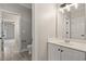 Powder room with vanity featuring a white countertop and a view to the bedroom at 4222 Congressional Dr., Myrtle Beach, SC 29579