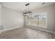 Dining room featuring wood floors, natural light, and modern light fixture at 4222 Congressional Dr., Myrtle Beach, SC 29579