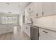 Bright kitchen with white cabinets, stainless appliances, island, and natural lighting at 4222 Congressional Dr., Myrtle Beach, SC 29579