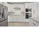 Bright kitchen with white cabinets and stainless steel appliances at 4222 Congressional Dr., Myrtle Beach, SC 29579