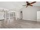 Spacious living area featuring a vaulted ceiling, wood floors, and seamless flow to the dining room at 4222 Congressional Dr., Myrtle Beach, SC 29579
