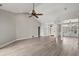 Open living area featuring a vaulted ceiling, wood floors, and seamless flow to the dining room at 4222 Congressional Dr., Myrtle Beach, SC 29579