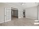 Open living room area featuring french doors, wood floors, and seamless flow to the kitchen at 4222 Congressional Dr., Myrtle Beach, SC 29579