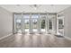 Bright sun room with lots of natural light, wood floors, and serene backyard views at 4222 Congressional Dr., Myrtle Beach, SC 29579