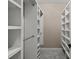 Spacious walk-in closet with custom white shelving for optimal storage at 4222 Congressional Dr., Myrtle Beach, SC 29579