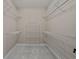 Walk-in closet with white wire shelving and neutral walls at 4222 Congressional Dr., Myrtle Beach, SC 29579