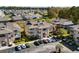 Gorgeous aerial view of the condo and complex with lush landscaping and ample parking in a desirable location at 4234 Pinehurst Circle # L1, Little River, SC 29566